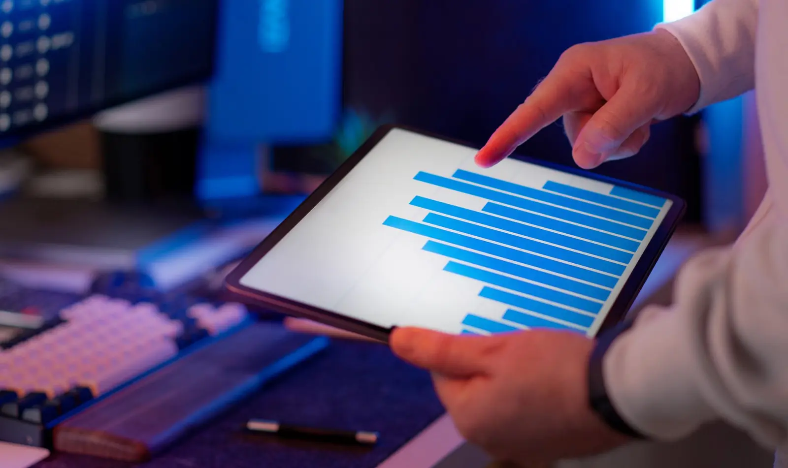 Analyst reviewing data on a digital tablet.