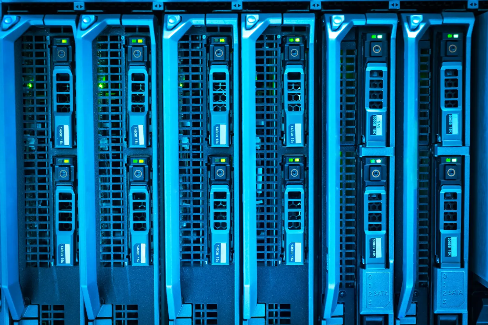 Illuminated server hardware in a data center rack, lit blue.